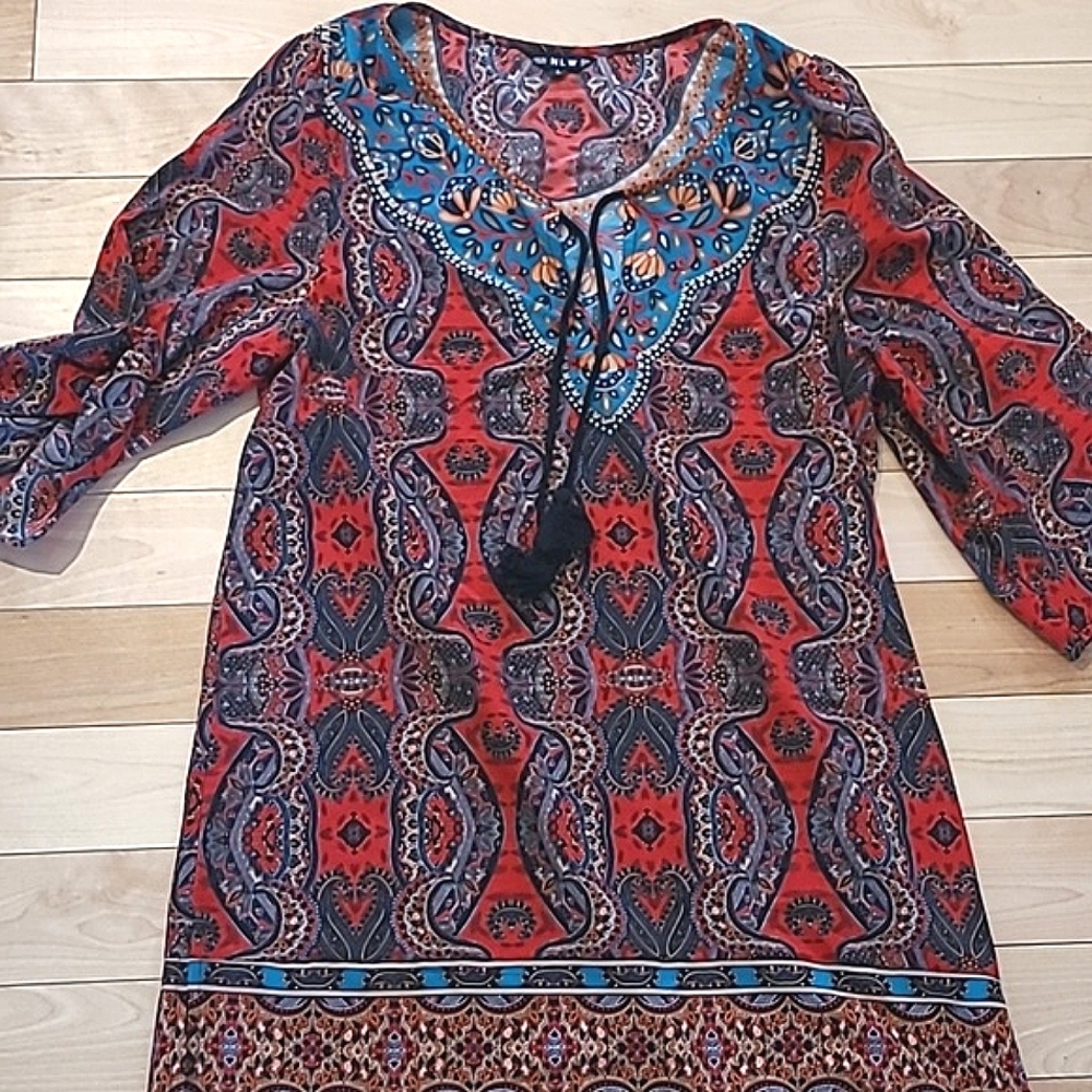 Blouse by nlw. Or dress